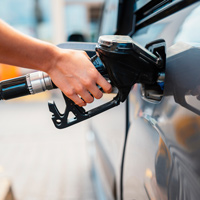 person filling car gas tank with wrong petrol concept