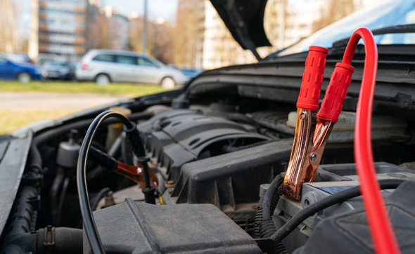 jump cables on car low power battery, broken car start attempt concept